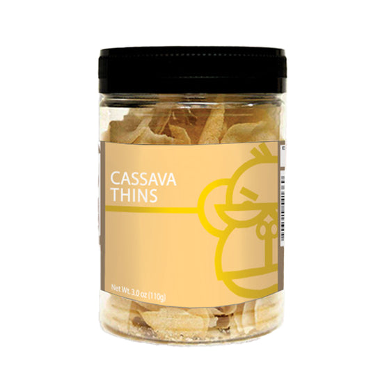 A jar of Orell's Cassava Thins, displaying the product through the transparent jar lid, with a label featuring the product name and a cartoon monkey.