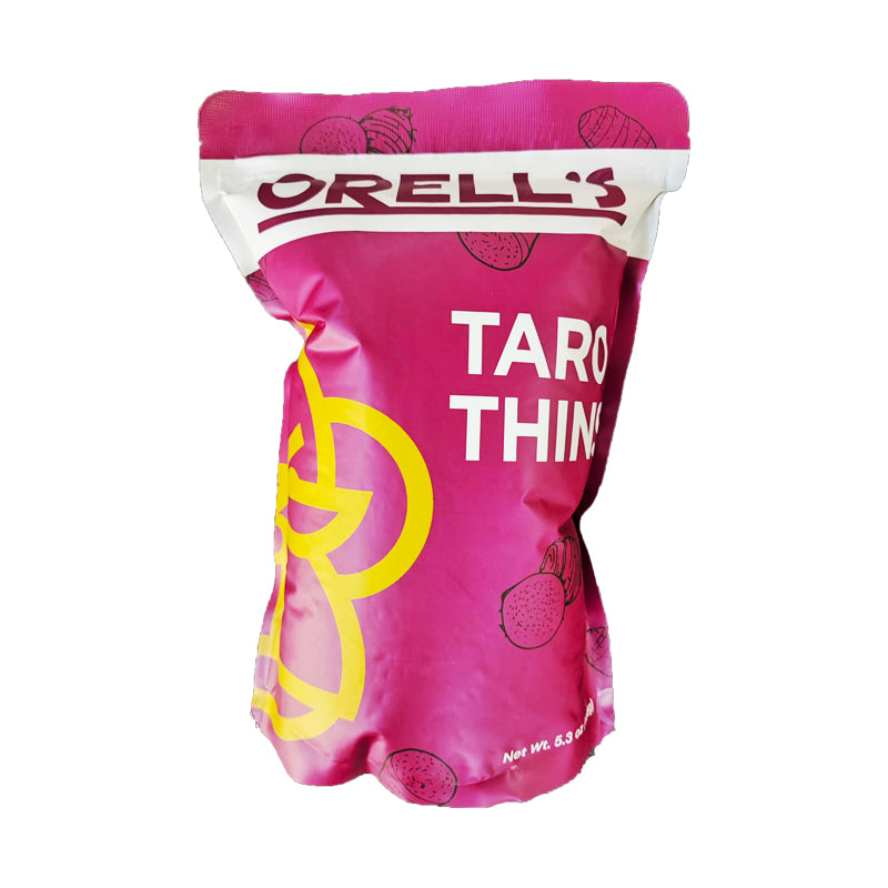 A pink pouch of Orell's Taro Thins with the product name and images of taro fruit on the packaging.